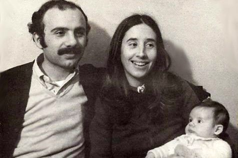 A black and white photo shows an Argentinian couple holding a baby boy.
