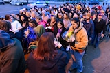 People line up to enter Graceland for Lisa Marie Presley's memorial service.