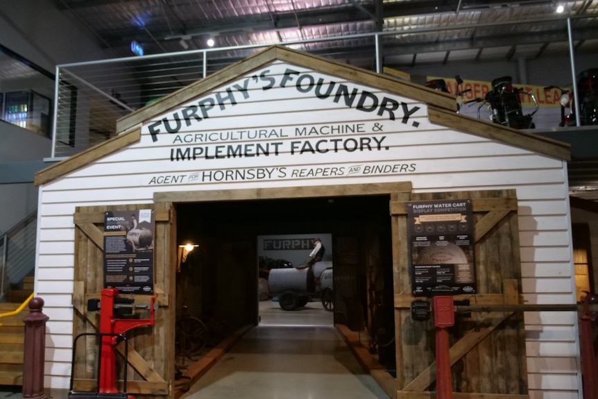 A wooden entrance to a museum exhibit withthe words "Furphy's Foundry".