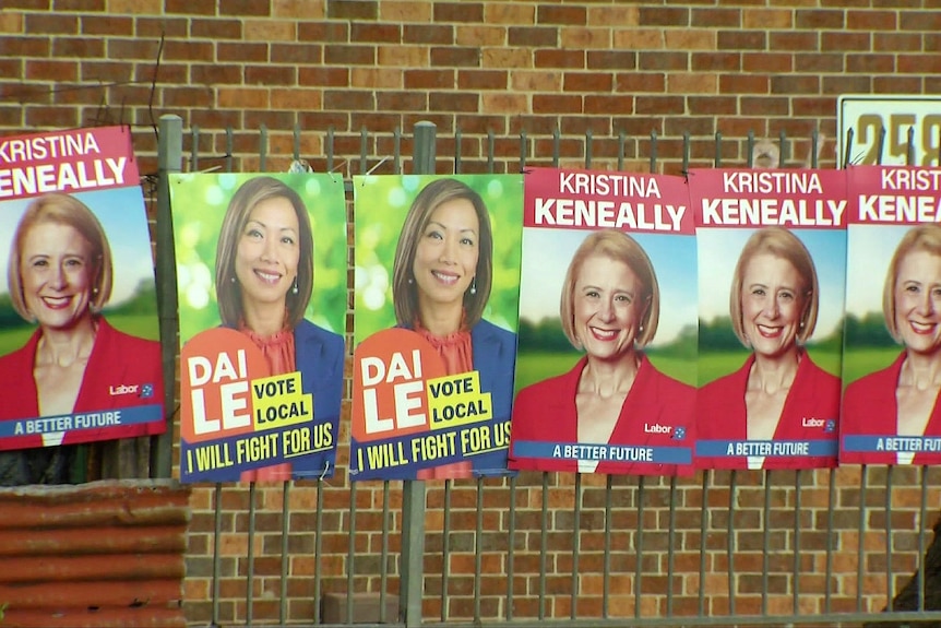 campaign posters on a wall