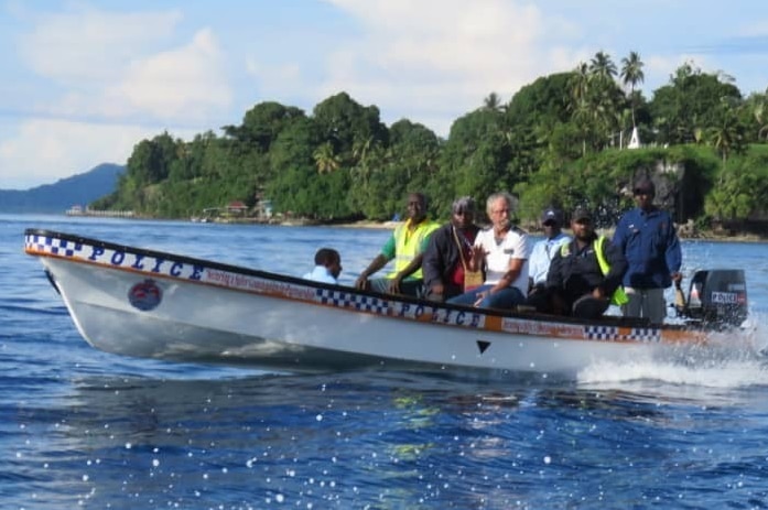 Mr McCracken and a rescue team head back to shore on a small vessel