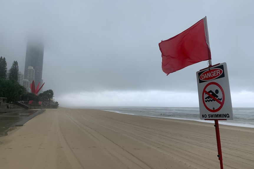 A closed Gold Coast beach on a very grey and rainy day.