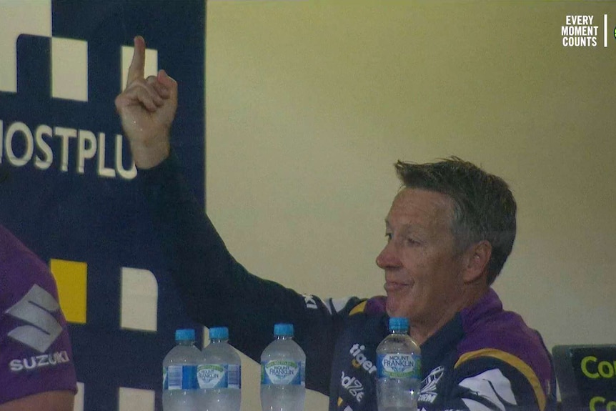 Melbourne Storm coach Craig Bellamy gives the finger to his team during a win over Wests Tigers.