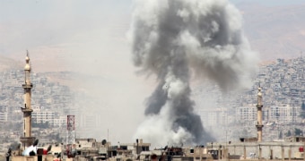 Smoke rises over the area of Eastern Ghouta