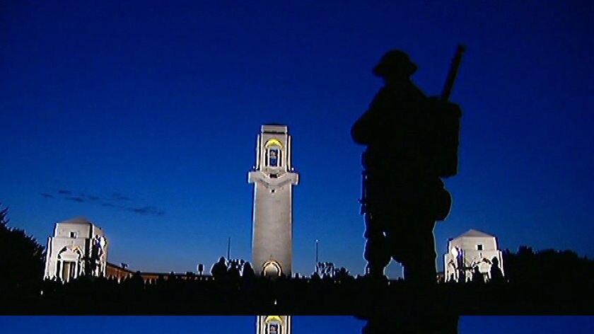 Soldier stands guard at Anzac Day dawn service in Villers Brettoneux, France