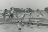An old photo of a scene at a public pool
