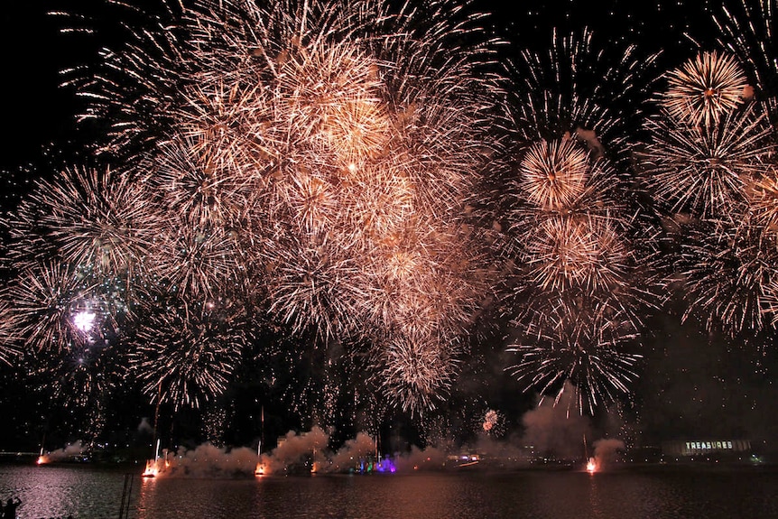 Fireworks light up Lake Burley Griffin for the grand finale.