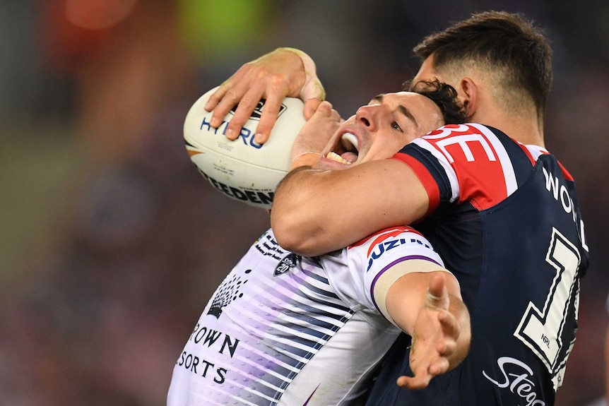 Billy Slater is tackled high by Ryan Matterson in the NRL grand final.