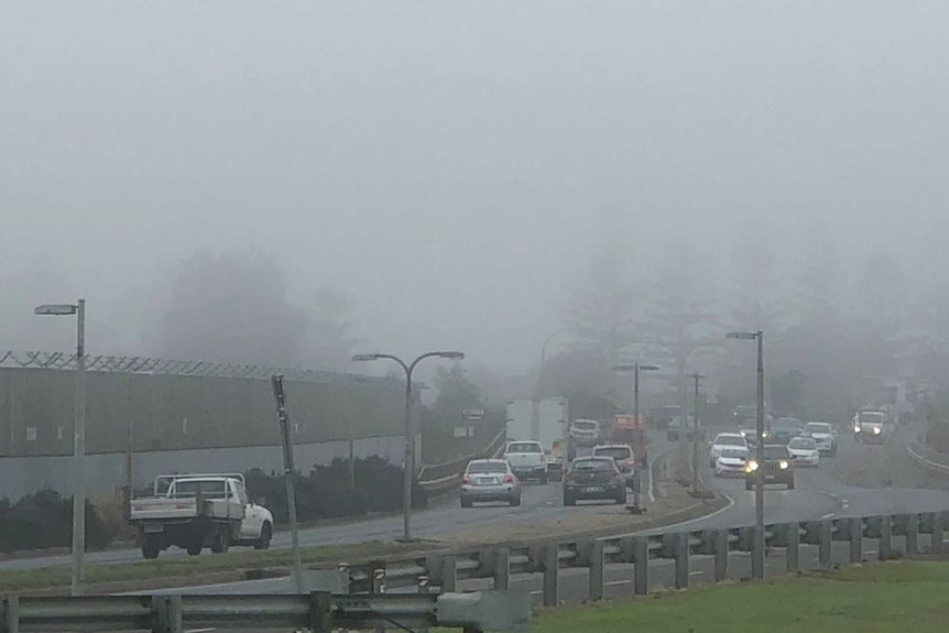 Heavy fog blankets above a busy Adelaide road on Monday, June 4, 2018. 