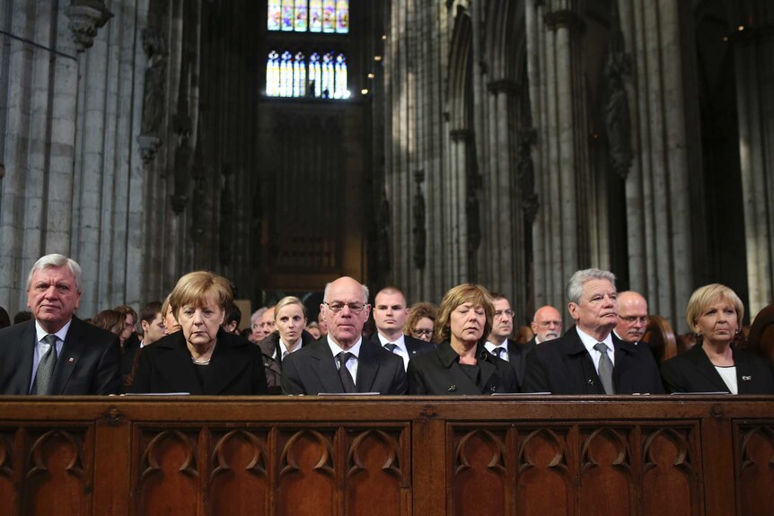 Mourners including German chancellor Angela Merkel attend memorial in Cologne