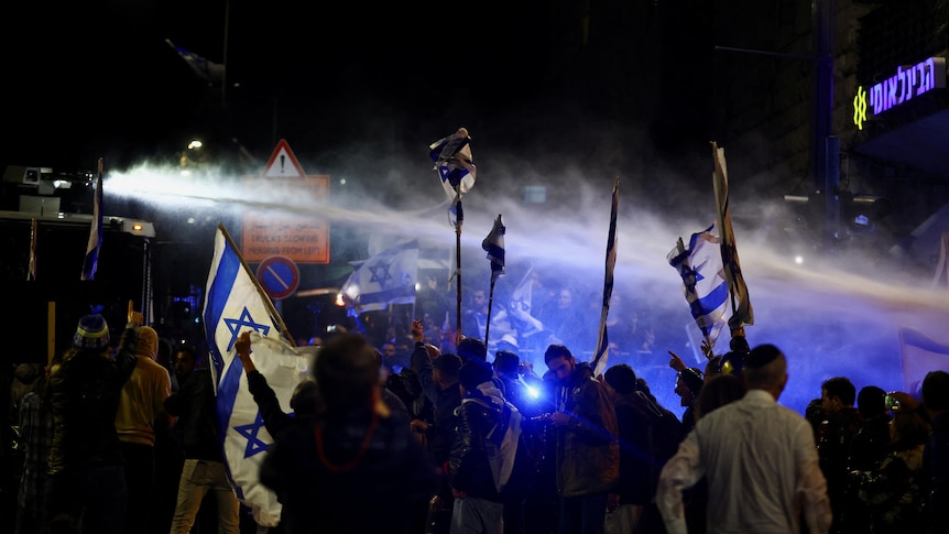 A water cannon is used as people attend a demonstration in Israel.