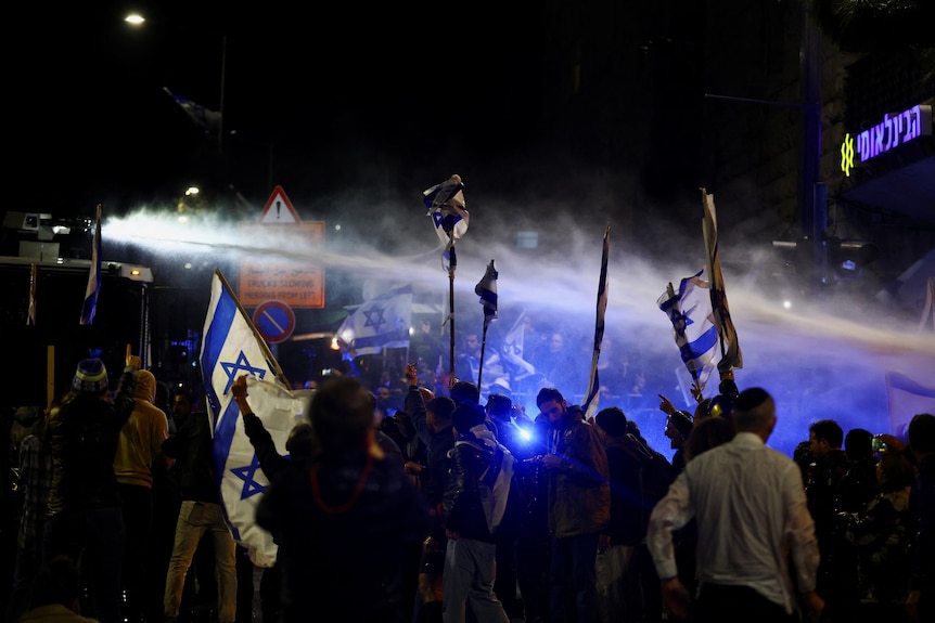 A water cannon is used as people attend a demonstration in Israel.