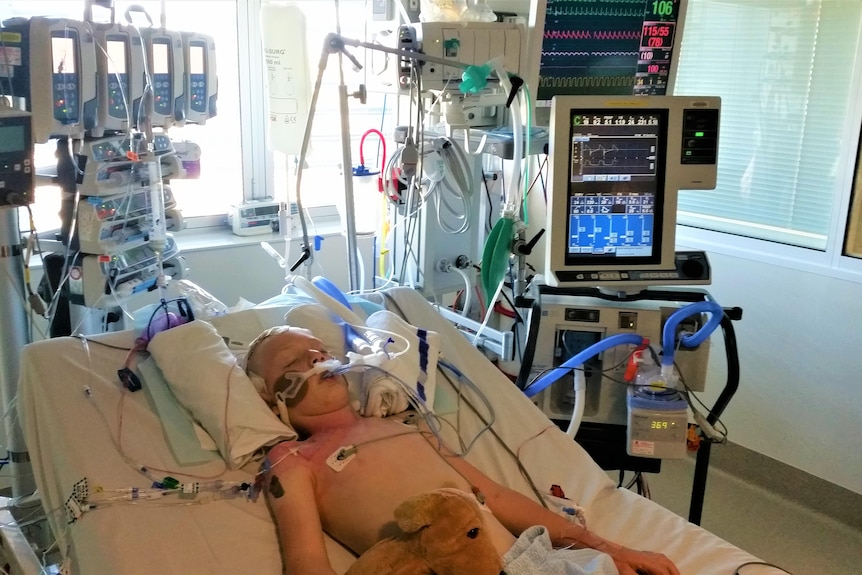 Dominic Coco laying in ICU