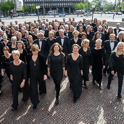 The Hamburg Symphonic Choir in their 'concert blacks', walking the streets of Hamburg, Germany