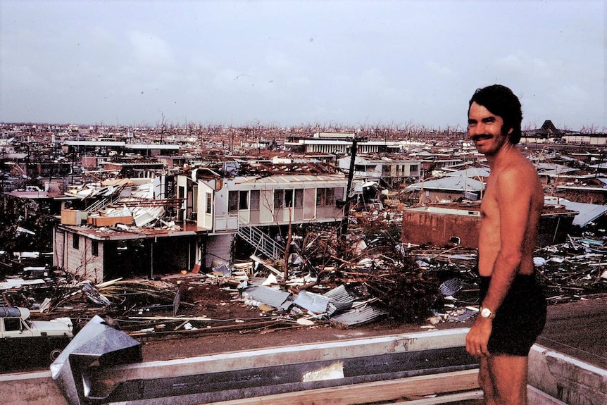 Territory resident Chris Adams stands amidst the destruction of Cyclone Tracy on Boxing Day 1974.