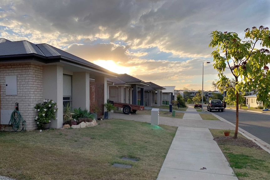 The sun sets on houses in a Ripley housing estate.