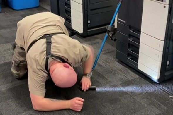 A snake catcher at the ABC's Adelaide offices at Collinswood.