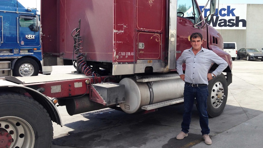 Frank Black stands next to his truck