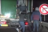 The men boarded the truck as it made its way from Calais to England.