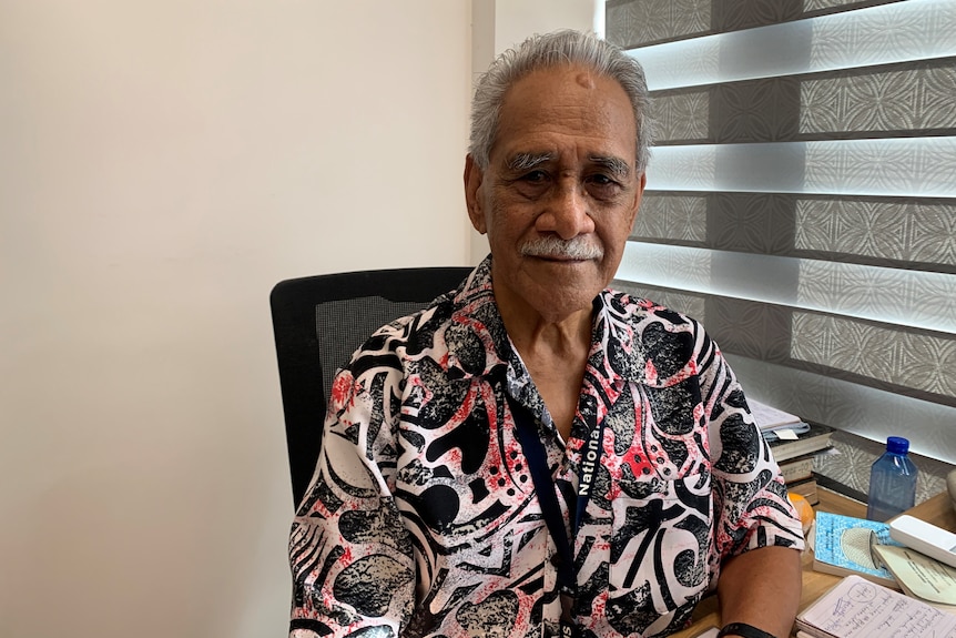 an older samoan man in a bula shirt 