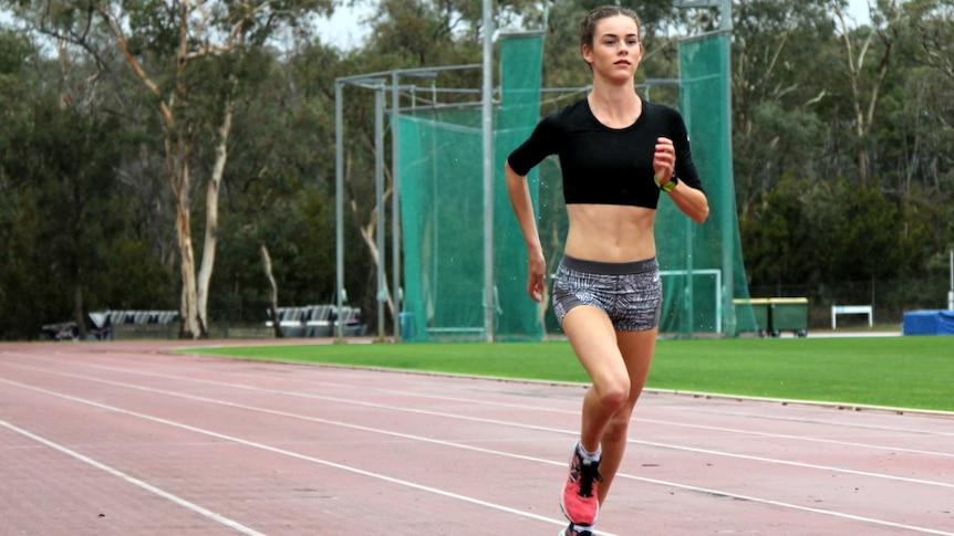 Athlete Keely Small running at the AIS athletics track.
