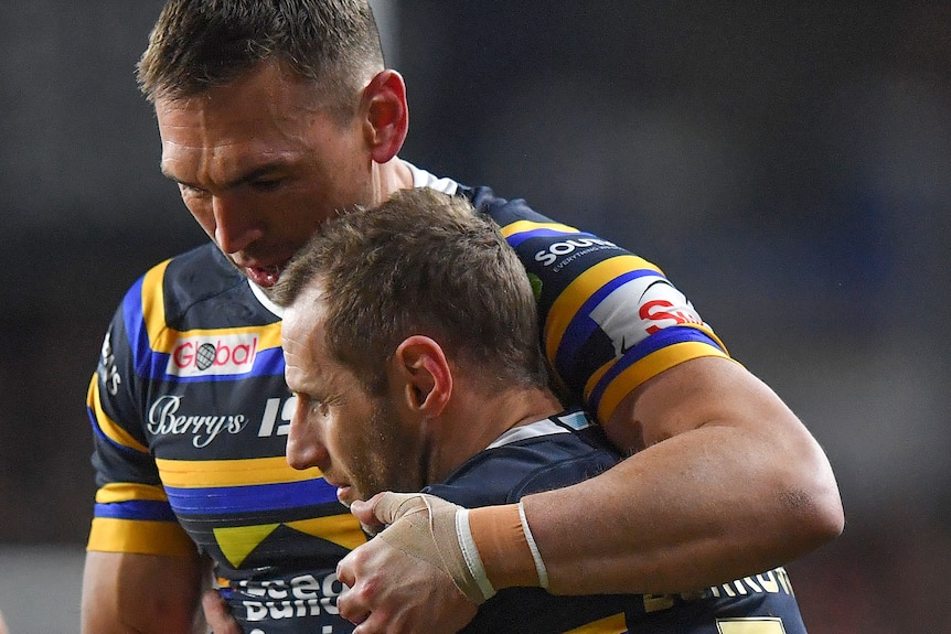 Kevin Sinfield hugs Rob Burrow after they played in the Jamie-Jones Buchanan testimonial match.