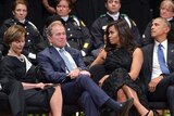Laura and George W Bush join Michelle and Barack Obama at Dallas memorial