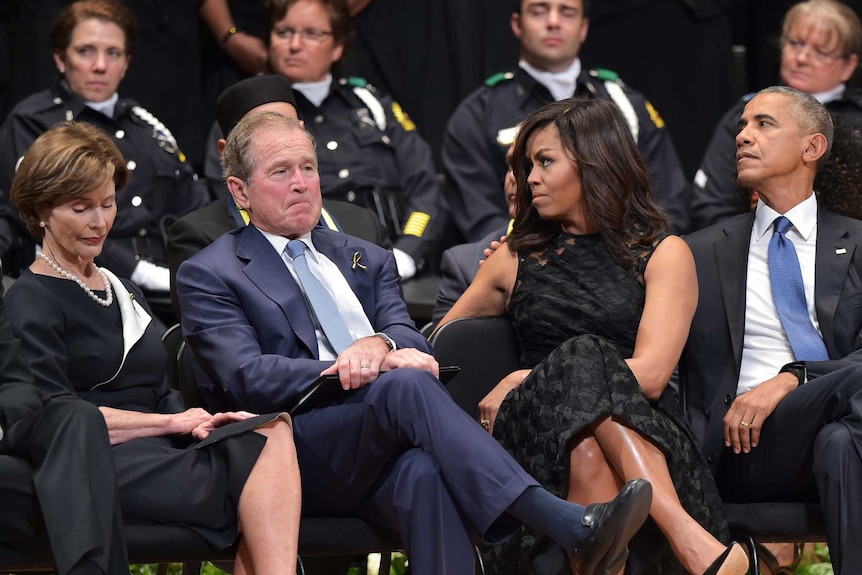 Laura and George W Bush join Michelle and Barack Obama at Dallas memorial