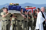 Ramp ceremony: caskets draped in the Australian flag were carried from an RAAF transport plane on Sunday.