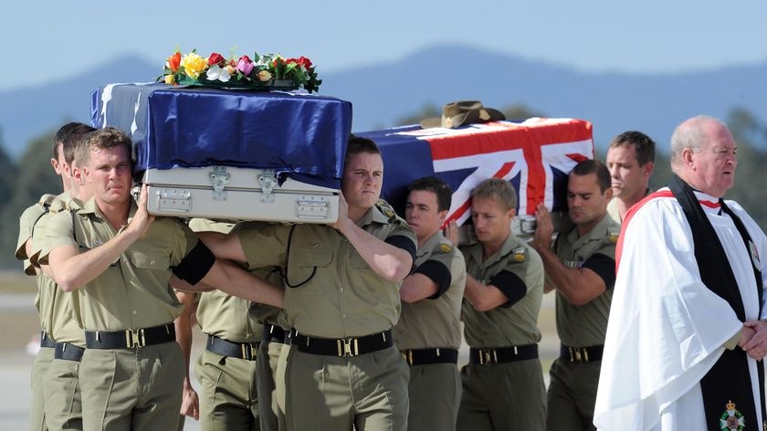 Ramp ceremony: caskets draped in the Australian flag were carried from an RAAF transport plane