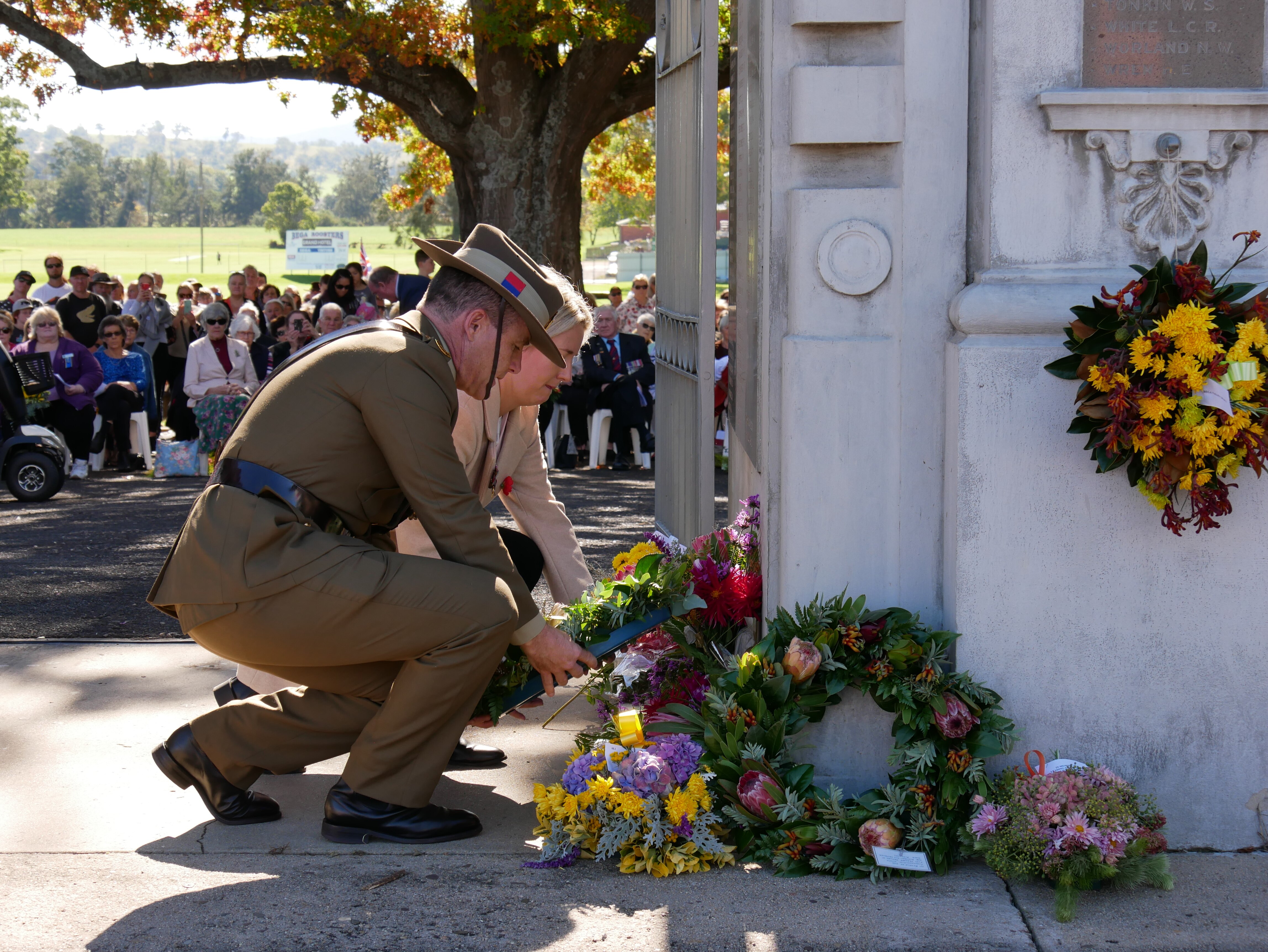 A soldier lays a wreath for anzac day.