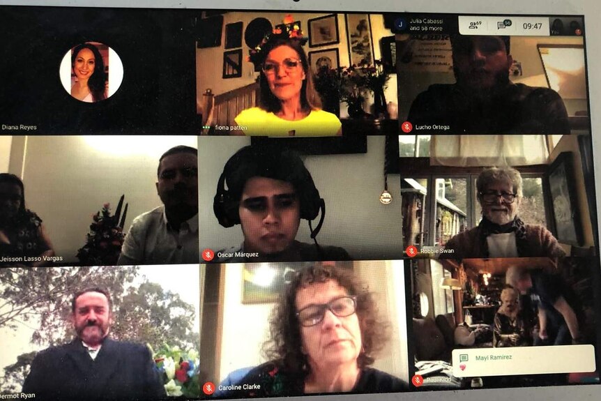 A zoom video conference screen with many different faces.