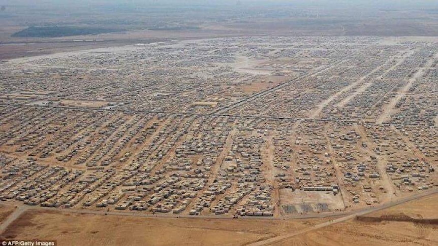 Aerial photo of a large tent city in desert