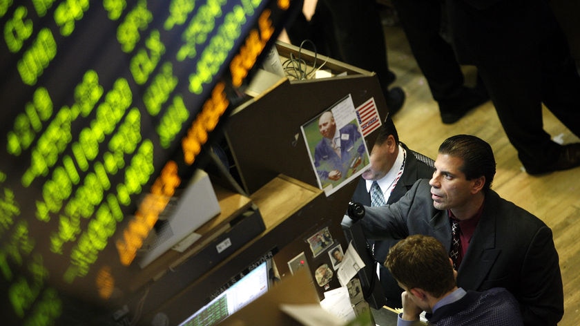 Traders work on the floor of the New York Stock Exchange on Wall Street