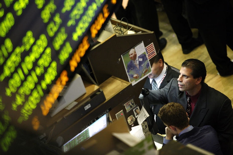 Traders work on the floor of the New York Stock Exchange