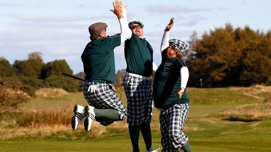 Competitors celebrate at the World Hickory Golf Championship at Monifeith Links golf course..