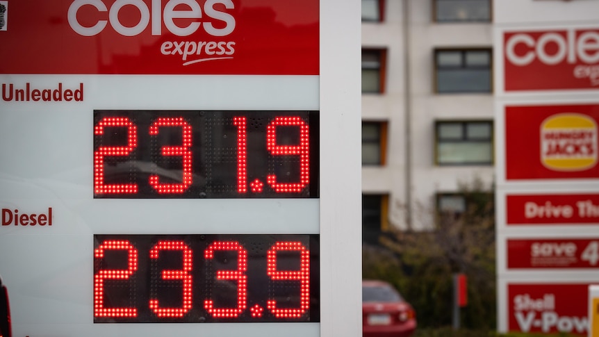 A close-up of a board displaying petrol prices for unleaded and diesel at Shell