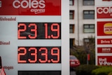 A close-up of a board displaying petrol prices for unleaded and diesel at Shell