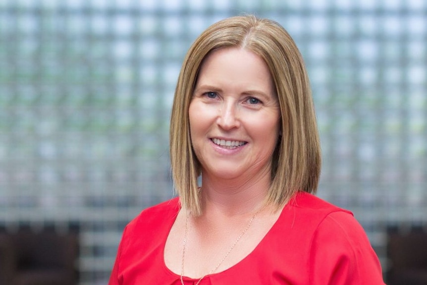 A woman in a red top.