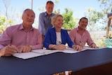 Steve Edgington, Bridget McKenzie, Nigel Scullion and Michael Gunner sign a statement of intent.