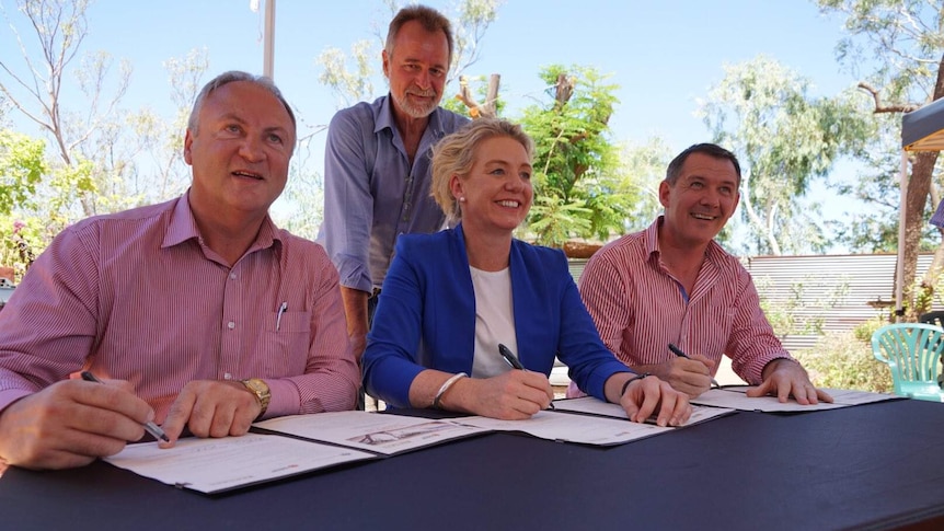Steve Edgington, Bridget McKenzie, Nigel Scullion and Michael Gunner sign a statement of intent.