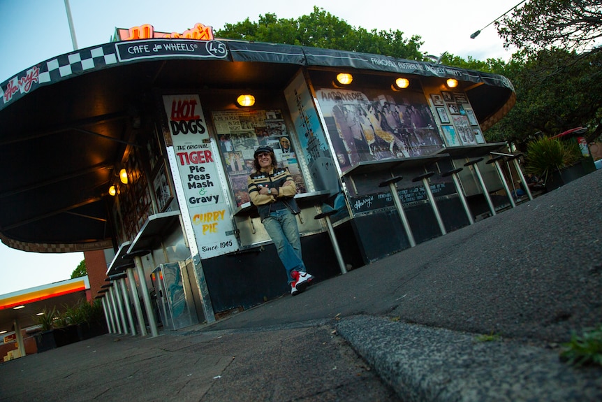 Arnie sits outside an iconic fast food cafe in Woolloomooloo.