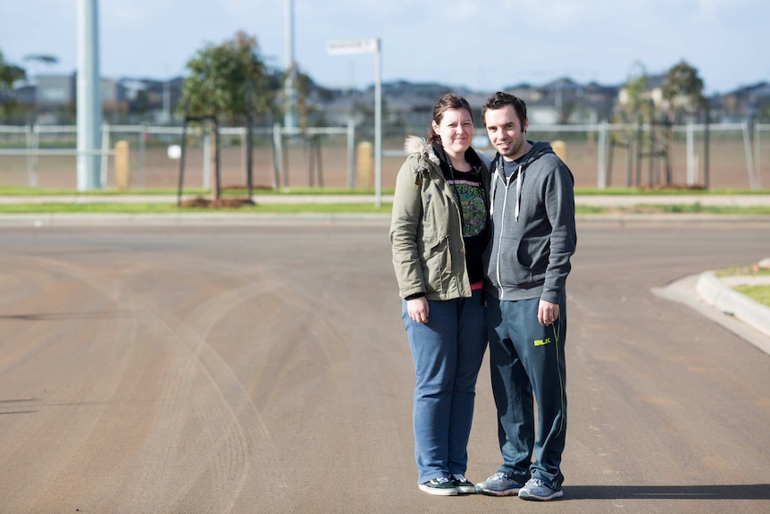 Matt Maclure and Nicki Ellis stand in their street in Truganina.