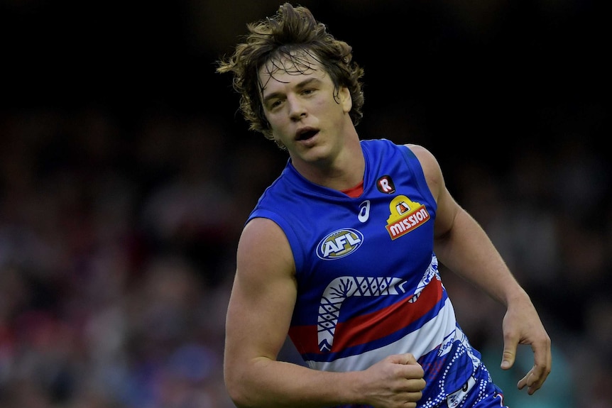 Liam Picken front on running after kicking a goal for the Bulldogs.