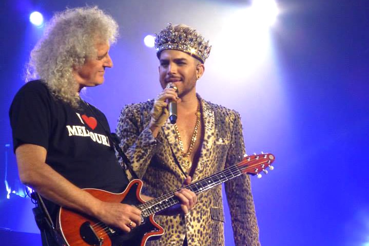 Queen guitarist Brian May performing with singer Adam Lambert.