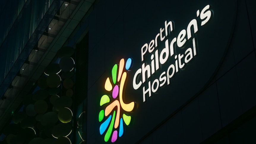 close up of Perth's Children Hospital sign illuminated at night