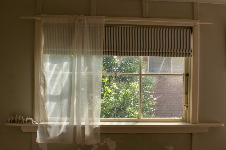 A window at the old Trigg beach house owned by Margaret Carmody.