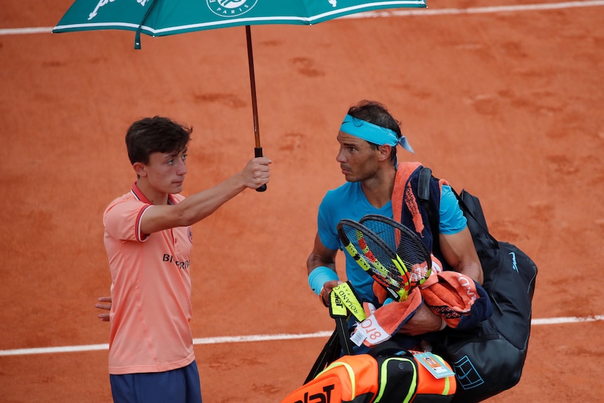 Nadal was serving for the second set when rain halted play.
