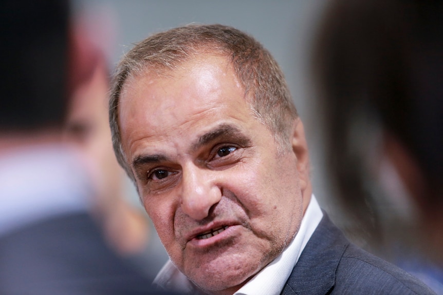 Victorian MP Khalil Eideh arrives at Tullamarine airport in Melbourne.