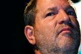 Harvey Weinstein stares down the barrel of the camera